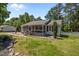 Delightful single-story home with a screened front porch and verdant landscaping, creating a welcoming curb appeal at 609 Chivalry Dr, Durham, NC 27703