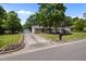 Charming home with a long driveway and beautiful landscaping at 609 Chivalry Dr, Durham, NC 27703