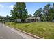 Quaint home showcasing a well-manicured lawn at 609 Chivalry Dr, Durham, NC 27703