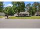Well-maintained home with a lush lawn and mature trees at 609 Chivalry Dr, Durham, NC 27703