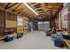 Spacious garage featuring exposed wood and shelving at 609 Chivalry Dr, Durham, NC 27703