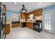 Well-appointed kitchen with stylish cabinetry, black appliances, and a view into the dining area at 609 Chivalry Dr, Durham, NC 27703