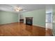 Inviting living room featuring a cozy fireplace and gleaming hardwood floors for a warm ambiance at 609 Chivalry Dr, Durham, NC 27703