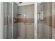 Walk in shower with neutral tones and a grab bar at 609 Chivalry Dr, Durham, NC 27703