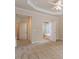 Bedroom with plush carpet flooring, view to the ensuite bathroom with a soaking tub at 716 Arbor Brook Dr, Cary, NC 27519