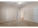 A cozy bedroom featuring neutral carpet, white trim, and a ceiling fan for added comfort at 716 Arbor Brook Dr, Cary, NC 27519