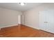 Empty bedroom featuring hardwood floors, double closets and neutral walls at 716 Arbor Brook Dr, Cary, NC 27519