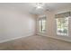 Bedroom featuring neutral walls and carpeting, crown molding and two windows at 716 Arbor Brook Dr, Cary, NC 27519