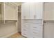 Walk-in closet with custom built-in storage and shelving system at 716 Arbor Brook Dr, Cary, NC 27519