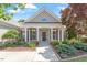 Inviting front entrance with meticulously maintained landscaping and a pathway leading to the covered porch with stately columns at 716 Arbor Brook Dr, Cary, NC 27519