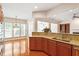 Modern kitchen with granite countertops, stainless steel appliances, and hardwood floors at 716 Arbor Brook Dr, Cary, NC 27519