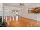 Open-concept living room featuring hardwood floors, fireplace, and plenty of natural light at 716 Arbor Brook Dr, Cary, NC 27519