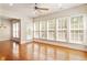 Bright and airy living room with hardwood floors, large windows, and an open layout at 716 Arbor Brook Dr, Cary, NC 27519