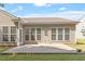 Brick patio with the view of the back of the house and its many windows at 716 Arbor Brook Dr, Cary, NC 27519