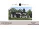Stunning two-story home featuring stone accents, large windows, and a well-manicured lawn at 7652 Falls Creek Ln, Raleigh, NC 27614
