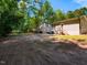 Backyard with a deck, wooden stairs, and a spacious yard at 801 Madison Ave, Cary, NC 27513