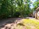 Backyard with wooded area, patio and deck creating a private outdoor oasis at 801 Madison Ave, Cary, NC 27513