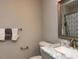 Elegant half bathroom showcasing a marble vanity, modern fixtures, and neutral color palette at 801 Madison Ave, Cary, NC 27513