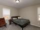 Cozy bedroom with natural light, complemented by comfortable furnishings and neutral tones at 801 Madison Ave, Cary, NC 27513