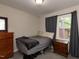 Serene bedroom with ample natural light and closet space, creating a relaxing atmosphere at 801 Madison Ave, Cary, NC 27513