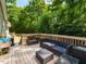 Spacious deck with outdoor furniture perfect for entertaining and enjoying the wooded views at 801 Madison Ave, Cary, NC 27513