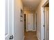 Well-lit hallway featuring hardwood floors and neutral paint, leading to multiple rooms at 801 Madison Ave, Cary, NC 27513