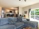 Comfortable living room with a large gray sectional sofa, and sliding glass doors to the patio at 801 Madison Ave, Cary, NC 27513