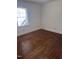 Bright bedroom featuring wood floors and a window with natural light at 808 Belvedere St, Rocky Mount, NC 27803