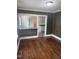 Living room featuring hardwood floors and serving counter from kitchen at 808 Belvedere St, Rocky Mount, NC 27803