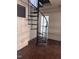 Living room featuring spiral staircase and unique architectural details at 808 Belvedere St, Rocky Mount, NC 27803