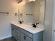 Modern bathroom featuring dual sinks, quartz countertops, and black hardware at 808 Hillfarm Dr, Wake Forest, NC 27587