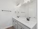 Elegant bathroom with double vanity sinks, quartz countertop, and sleek fixtures at 808 Hillfarm Dr, Wake Forest, NC 27587