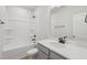 Bright bathroom with white vanity, quartz countertop, and a shower-tub combination at 808 Hillfarm Dr, Wake Forest, NC 27587