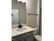 Bright bathroom featuring gray vanity, black hardware, and a shower with sliding glass doors at 808 Hillfarm Dr, Wake Forest, NC 27587