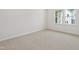 Cozy bedroom with plush carpeting and a bright window providing natural light at 808 Hillfarm Dr, Wake Forest, NC 27587