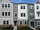 Charming new construction townhome showcases neutral colors and a well-manicured lawn at 808 Hillfarm Dr, Wake Forest, NC 27587