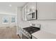 Modern kitchen showcasing quartz countertops, stainless steel appliances, and bright cabinets at 808 Hillfarm Dr, Wake Forest, NC 27587
