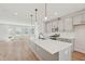 Bright, open kitchen featuring an island, stainless appliances, and hardwood floors at 808 Hillfarm Dr, Wake Forest, NC 27587