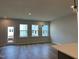 Bright living room with hardwood floors, recessed lighting, and a glass door at 808 Hillfarm Dr, Wake Forest, NC 27587