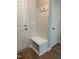 Mudroom featuring a bench seat with storage, hooks, and easy access to other rooms at 808 Hillfarm Dr, Wake Forest, NC 27587