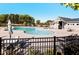 Community pool area with a large pool, lounge chairs, umbrellas, and a pool house for residents to enjoy at 808 Hillfarm Dr, Wake Forest, NC 27587