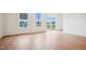 Bright bedroom features hardwood floors, two windows and sliding glass doors to a deck at 860 Parc Townes Dr # 70, Wendell, NC 27591