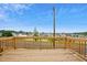 View from a wood deck overlooking the road and neighborhood, with a blue sky above at 860 Parc Townes Dr # 70, Wendell, NC 27591