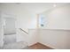 Upstairs hallway featuring carpeted floors and natural light at 860 Parc Townes Dr # 70, Wendell, NC 27591
