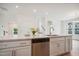 Open kitchen with island, stainless steel dishwasher, and view of neighborhood at 860 Parc Townes Dr # 70, Wendell, NC 27591