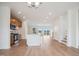 Open-concept floorplan featuring hardwood floors, kitchen with an island, and a sliding glass door at 860 Parc Townes Dr # 70, Wendell, NC 27591