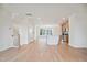 Spacious open-concept living room showcases hardwood floors, kitchen, and stairs to the upper level at 860 Parc Townes Dr # 70, Wendell, NC 27591