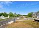 View of the road, sidewalks, and neighborhood with new construction townhomes at 860 Parc Townes Dr # 70, Wendell, NC 27591