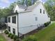 Back exterior view of a multi-story home with a mix of siding and brick finishes at 1005 Collins Dr, Raleigh, NC 27609
