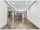View of the finished basement featuring a bar area with stone accents and stainless steel refrigerator at 1005 Collins Dr, Raleigh, NC 27609